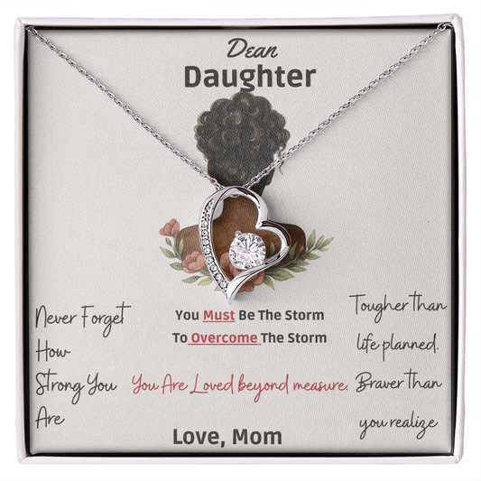 Engraved mother to daughter necklace reading “Never forget how strong you are” with floral motif pendant
